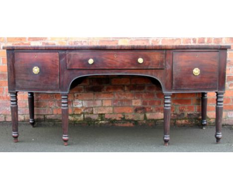 A large William IV inlaid mahogany bow front sideboard, with three drawers, on turned and fluted tapered legs, 97cm H x 215cm