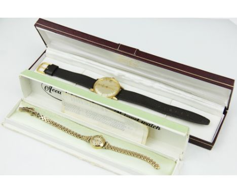 A ladies 9ct yellow gold Accurist wristwatch, with guarantee dated 1960 and later strap 1965, weight 14.4gms and an Omega 'Au