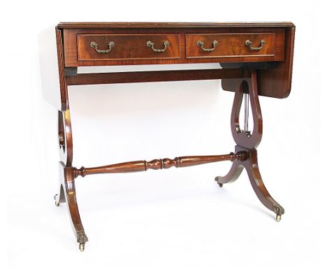 A Regency style mahogany Pembroke table, with two drawers and lyre end supports, 92cm H x 165cm W x 57cm D