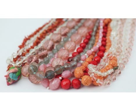 A collection of ten bead necklaces, to include; stick coral, carved wooden floral beads, carved coral coloured beads, a gradu