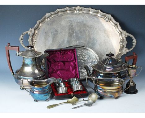 A selection of silver plated wares to include a set of six cased belt and buckle form napkin rings, a Victorian two handled s