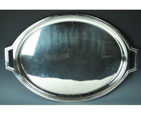 An Elkington silver plated serving tray, the angular twin handled oval tray with a typical Art Deco design, 59cm wide