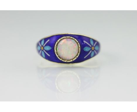 An opal and enamelled 9ct yellow gold ring, 'PSR', Birmingham 1975, set with a central circular opal within blue enamelled sh