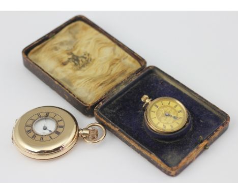 A  ladies yellow metal fob watch circa 1900, the gilt decorative dial with black Roman numerals, case stamped '14k', weight 2