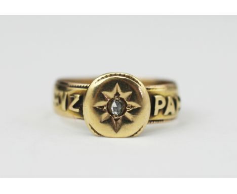 A Victorian diamond set Mizpah ring, Birmingham 1876, with central circular panel set with a diamond, the 18ct yellow gold ho