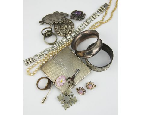 A collection of assorted costume jewellery, to include; a marcastie set circular cluster ring, assorted silver coloured brooc