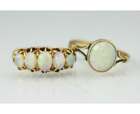 A Victorian five stone opal ring, Birmingham 1896, the five graduated stones all set in 18ct yellow gold, size P and a single