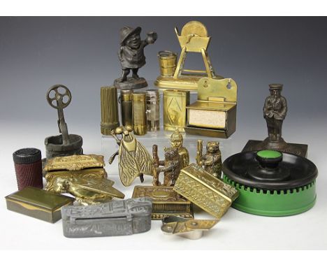 A collection of brass and other metal ware table and match boxes, to include; a bronzed well with wheel striker, 13.5cm high,