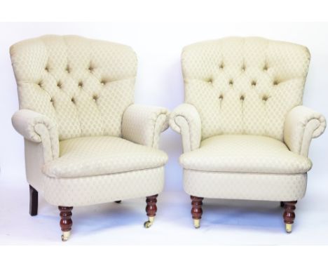 A pair of button back salon chairs, with patterned ivory upholstery, on turned legs with fitted casters, 97cm H