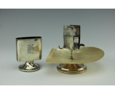 A silver and mother of pearl smokers stand, 'W&G', Sheffield 1933, the mother of pearl shell forming the ash tray, with centr