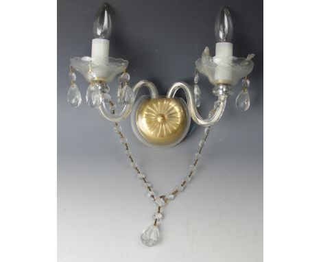 Six cut glass twin branch wall lights with scroll centre arm and circular back plates, four similar twin branch glass wall li