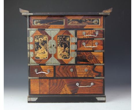 A Japanese parquetry table top cabinet, with an arrangement of drawers and doors, 36cm H x 35cm W x 20cm D, with a George III
