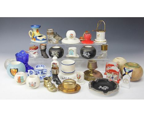 A quantity of assorted strikers, to include; spherical ceramic and glass examples, assorted boot form strikers including silv