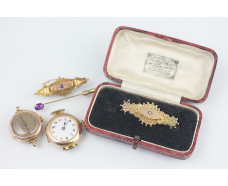 Two ladies gold watch faces along with a diamond set Victorian bar brooch a further brooch and a stick pin (5) 