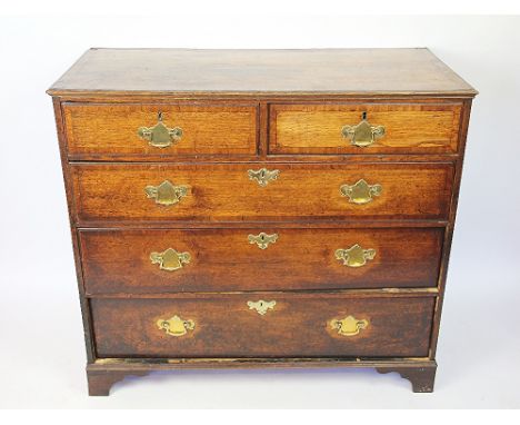 A George III oak chest, with two short and three graduated long drawers, on bracket feet, 93cm H x 104cm W x 50cm D