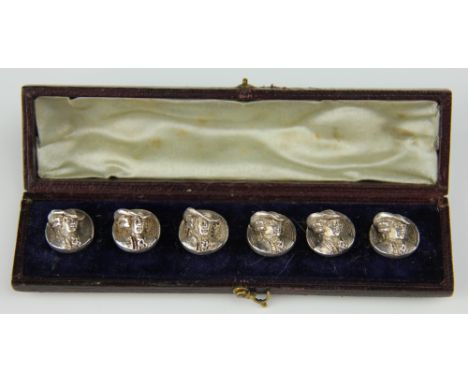 A set of six white metal buttons, each cast with a bust of a gentleman in a hat and late 18th century costume, in original le