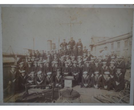 A pair of early 20th century Naval photographs, depicting a ship within Maltese harbour and crew upon deck, framed and glazed