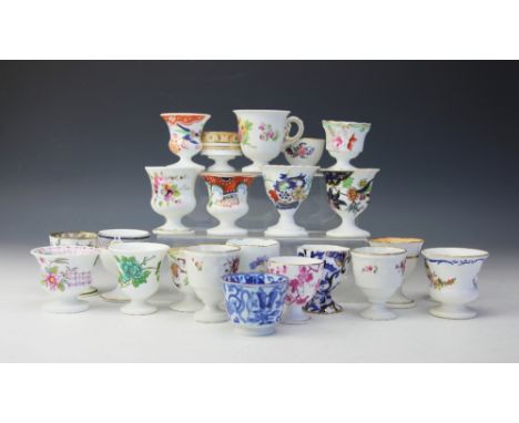 A collection of twenty three 19th century and later egg cups, mostly Coalport, to include a flared and shaped rim example pri