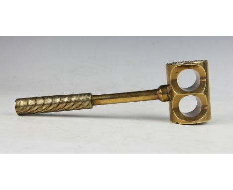 An unusual brass mallet believed from a military bomb disposal kit, the head with two circular apertures and grooved ends, wi