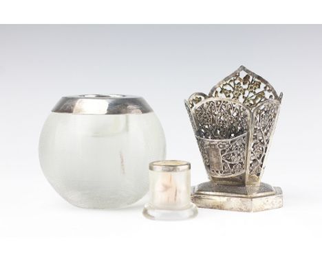 A continental white metal spill and match stick holder, of blossoming pierced design, stamped 'WH' '90', 11cm high, along wit