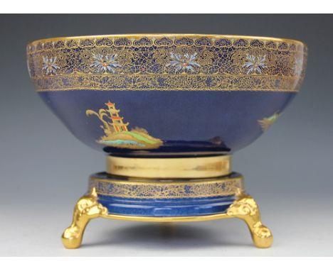 A large Carltonware chinoiserie bowl on stand, decorated with figures, pagodas and birds, on stand with scroll legs, 25cm dia