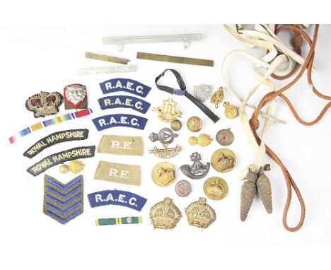 A miscellany of military buttons, badges, etc,to include a Kings Shropshire Light Infantry cap badge (Qty)