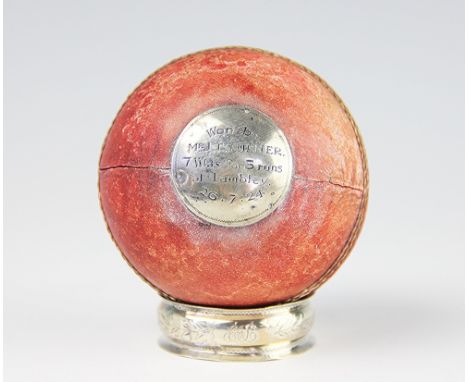 A white metal mounted presentation cricket ball, engraved 'Presented to Mrs E. Ash by Scotholme C.C, Won my Mrs J Turner, 7 W