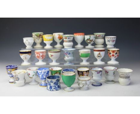 A collection of twenty nine 19th century and later egg cups, mostly Spode, to include two early 19th century Spode examples o