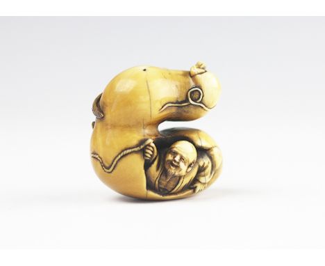 A Japanese carved ivory netsuke, Meiji period 1868-1912, modelled as Chokwaro Sennin with gourd and magic horse, signed - pro