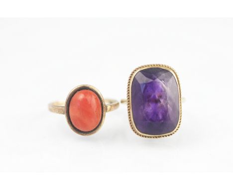 An amethyst set dress ring, all set in 9ct yellow gold and a coral cabochon set ring set in yellow metal, total weight 9gms (