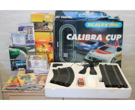 SCALEXTRIC & VIDEO GAMES - a boxed Scalextric Calibra Cup set (one car), PS2 games, PS3 games (Fifa), PC games and a selectio