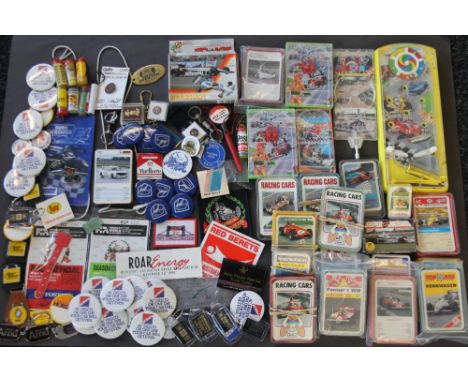 MOTOR RACING GAMES & MISC - a selection of vintage hand held racing games, racing car cards, badges, ear plugs, keyrings and 
