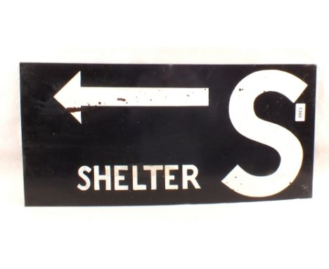 A painted metal sign 'Shelters with Arrow'