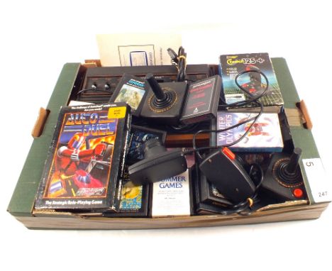 Atari CX2600 Woody games console, Cheetah 125 joystick, Atari joysticks, Atari paddles plus Atari games including Space Invad
