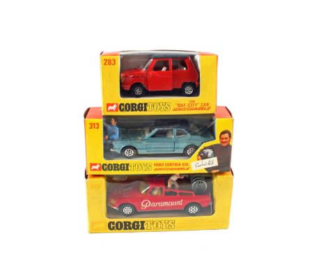 Boxed Corgi Whiz Wheels, 510 Tour de France Citroen, 283 DAF city car and 313 Ford Cortina blue body with Graham Hill