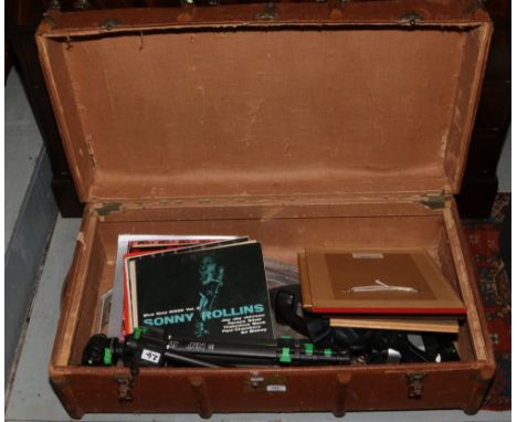 A vintage wood bound trunk and contents to include Jazz records, Cullman tripod, Viners silver plate serving tray etc.