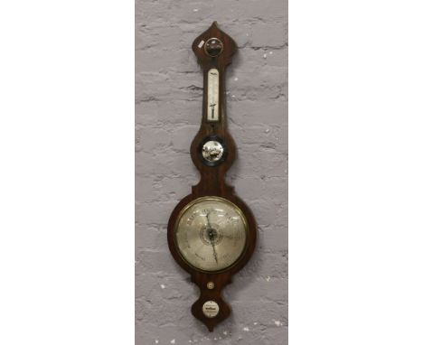 An early 19th century mahogany cased banjo barometer. Maker L. Monastere.