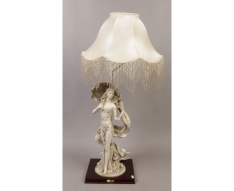 A composite figural table lamp from the Juliana collection formed as a lady in evening dress with ivory silk shade with bead 