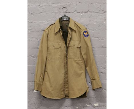 A post World War II US military heavy twill tan shirt with US Airforce patch to shoulder, along with a similar dark khaki shi