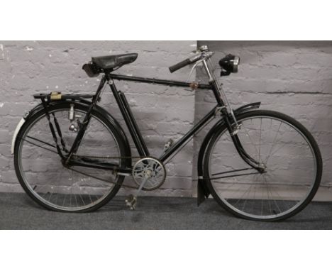 A pre World War II Raleigh bicycle with chrome fittings, dynamo lighting Sturmey - Archer three speed gears and miller headli