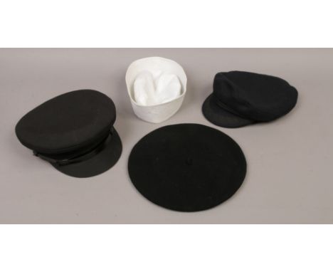 Four various hats; a black Breton, a US Navy style pudding basin black wool beret and a black chauffeurs example.