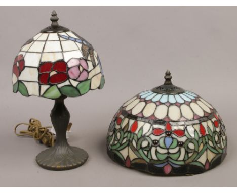 A Tiffany style table lamp with leaded stain glass shade, decorated with dragonflies along with another Tiffany style shade.