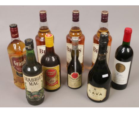 Three 1 litre bottles of Bells blended Scotch Whisky, along with a 70cl bottle of Grants Whisky and a collection of various b
