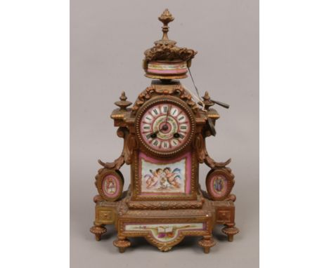 A 19th century French gilt metal eight day mantel clock striking half hourly on a bell and with pink ground Sevres panels.