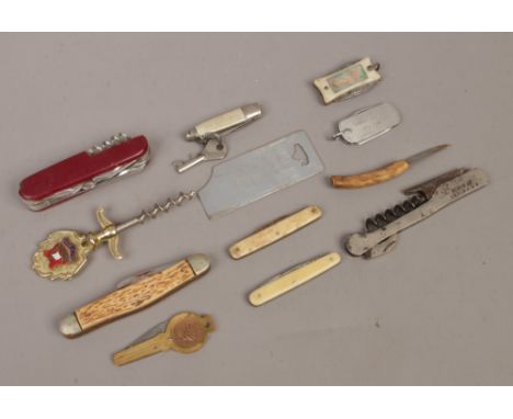 A collection of penknives and corkscrew to include multi tool pen knife, bone handled examples etc.