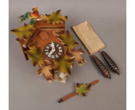 An unused German cuckoo clock, still with original paper packaging and instructions.