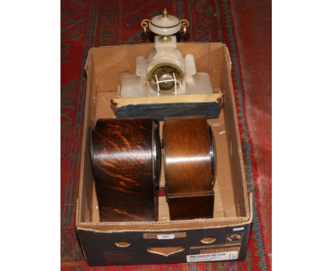 A box containing two oak cased mantel clocks including a Westminster chime example, along with an alabaster mantle clock.Cond