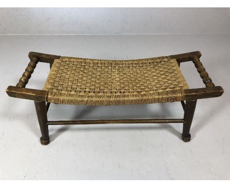 Oak framed rush seated bench / stool on turned tapering legs with bobbin turned handles, approx 85cm x 30cm x 36cm tall
