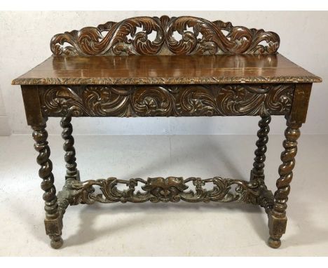 Heavily carved console table with carved drawer to front, carved stretcher and upstand on barley twist legs, approx 107cm x 4