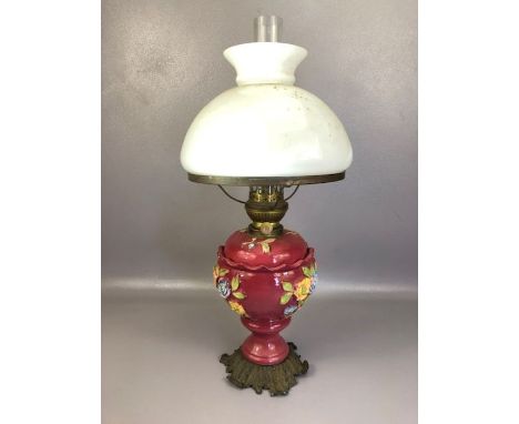 Victorian brass and ceramic oil lamp with floral design, metal foliate base, opalescent shade and clear glass chimney, approx